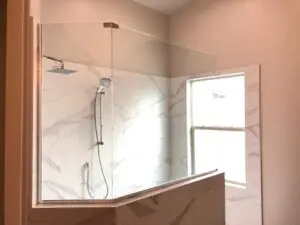 A Shower Cabinet With a Marble Wall